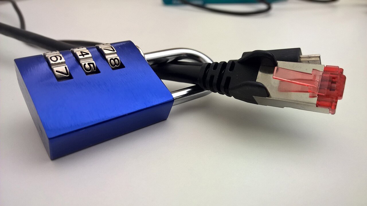 A padlock on an ethernet cable, signifying digital security and privacy.